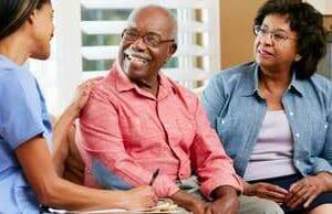 A man and woman sitting next to each other.