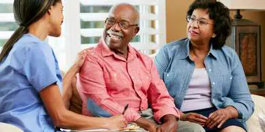 A man and woman sitting next to each other.