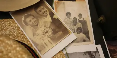 A couple of old photographs are laying on the floor